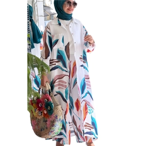 Women's two-piece casual set featuring long floral cardigan and wide-leg trousers in white