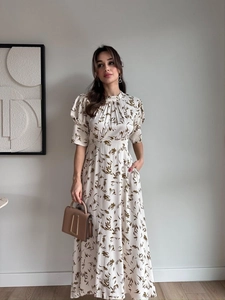 Detail view of cream floral satin dress featuring high waist and puff sleeves