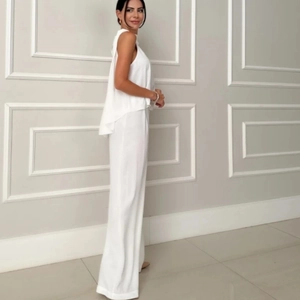 Elegant white two-piece set featuring a layered sleeveless top and high-waist wide-leg pants