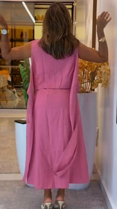 Back view of elegant rose pink sleeveless top with long side ribbons and matching skirt
