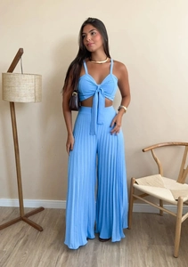 Detailed view of light blue two-piece set featuring pleated wide-leg pants and crop camisole