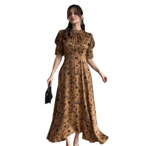 Elegant brown floral satin maxi dress with puff sleeves and waist tie for a stylish look