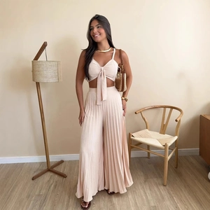 Chic beige pleated two-piece set featuring spaghetti strap tie-front top and wide leg pants