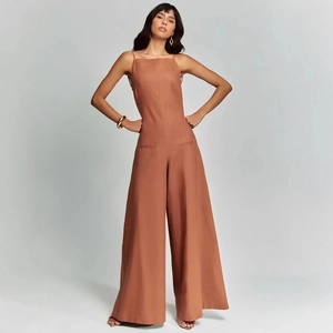 Modern rust red square neck wide-leg jumpsuit with minimalist design and waist pockets
