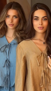 Detailed texture of tie-neck tops in light blue and khaki with elegant pleated fabric
