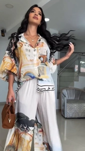 Artistic landscape print two-piece set featuring lantern sleeve shirt and wide-leg trousers