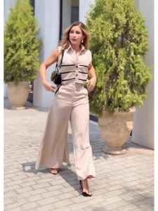 Women's chic beige sleeveless top and wide-leg trousers set with black stripes