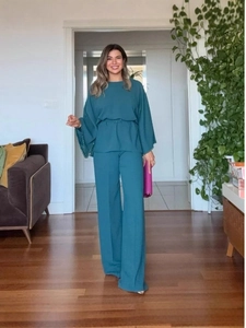 Elegant teal two-piece set featuring long sleeve top with beaded cuffs and wide leg pants