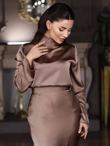 Elegant deep brown satin two-piece set featuring long sleeve top and matching maxi skirt
