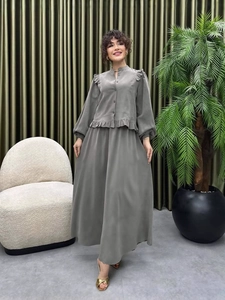 Elegant grey two-piece set featuring a ruffled long-sleeve blouse and flowy maxi skirt