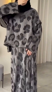 Detail of gray and black leopard print fabric on a long sleeve top and maxi skirt set