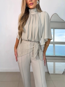 Elegant beige high-neck chiffon top with ruffled sleeves and matching trousers outfit