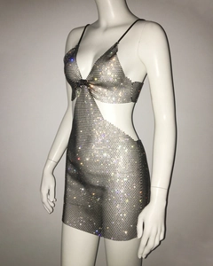 Detail of silver fishnet mesh dress with sparkling rhinestones and waist cut-outs