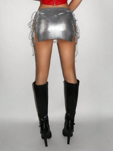 Silver metal sequin mini skirt with side ties and chainmail texture shown on model