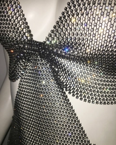 Detail of black mesh body chain with sparkling rhinestones for glamorous evening wear