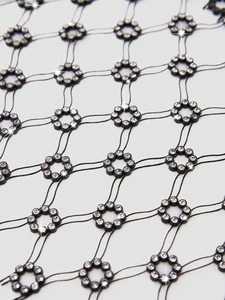 Sexy black fishnet top with rhinestone floral accents for music festival outfits
