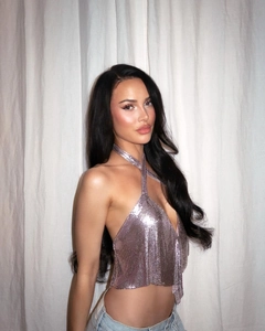 Detail of pink sequins halter top featuring a deep V-neck and sparkling metal mesh texture