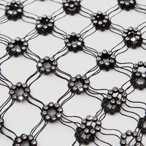 Sparkling rhinestones on black fishnet long sleeve top for party festival outfit