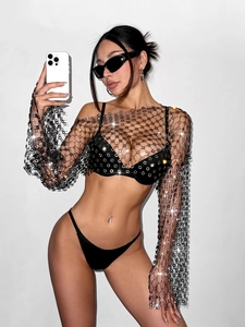 Close-up of sexy long sleeve mesh top with sparkling rhinestones for music festivals