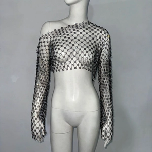 Detail of black rhinestone mesh crop top with flower patterns for festival wear