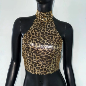 Detailed view of leopard print gold sequin halter crop top on a female mannequin