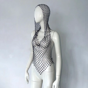 Detail view of black fishnet rhinestone hooded top with intricate flower-shaped grid patterns