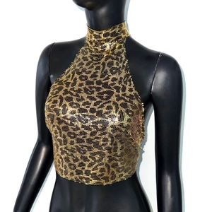 Detailed view of leopard print metal mesh halter top with shimmering gold and black texture