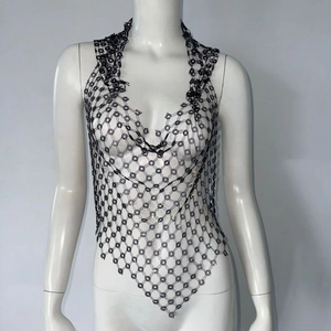 Close-up of black fishnet halter top with rhinestone mesh and deep V-neckline