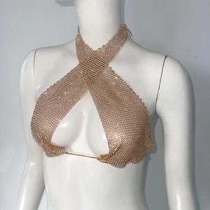 Detail of rose gold rhinestone mesh crop top featuring cross halter neck and crystal grid