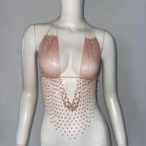 Detailed view of pink beaded halter body chain featuring mesh fringe for music festivals