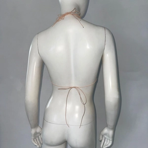 Detailed back view of pink rhinestone mesh top featuring adjustable bow tie-up straps