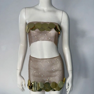 Detailed view of women's gold metal mesh two-piece set with large round sequin trim