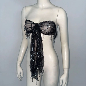 Sparkly black sequin tube top with large bow design and mesh tassels for music festivals