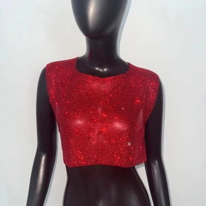 Close-up of vibrant red rhinestone chain crop top with sparkling diamond texture