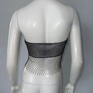 Detail of black rhinestone mesh crop top with fishnet tassels for festivals