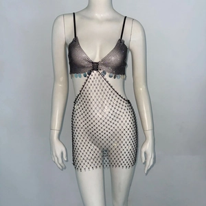 Detail of black mesh mini skirt with silver rhinestones and sexy bikini top piece