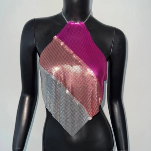 Detail of metallic mesh halter top with pink and gold sequin patchwork design