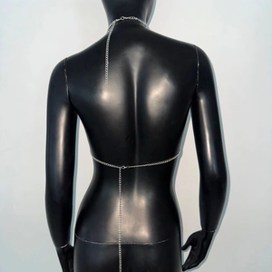 Detail of silver body chain jewelry with adjustable layered metal link straps on back