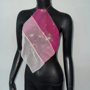 Close-up of pink gradient rhinestone halter top featuring metal mesh and pointed hemline