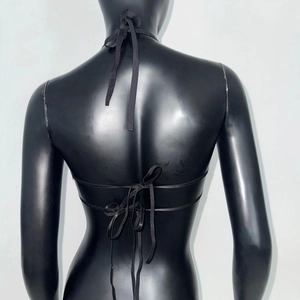 Detail showing the adjustable criss-cross back tie straps on this black halter top