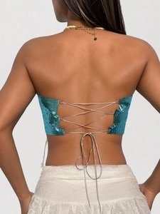 Metallic turquoise sequin crop top featuring an adjustable cross back lace-up design