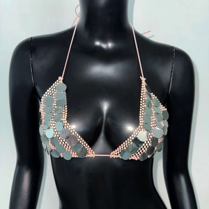 Detail of pink beaded mesh halter top with silver round sequins for music festivals