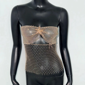 Sexy rhinestone fishnet body chain with starfish detail on a black mannequin display