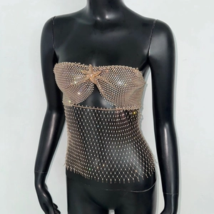 Detail of rhinestone bustier with starfish decoration and sparkly mesh hollow hemline