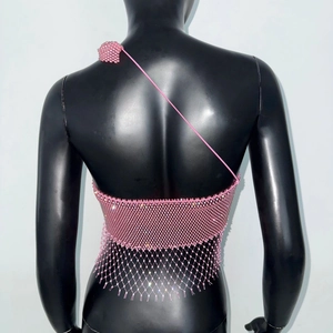 Close-up of pink handmade beaded mesh crop top with floral shoulder detail and rhinestones