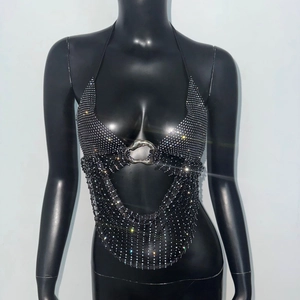 Detail of black halter top with sparkling rhinestones and a silver metal ring connector