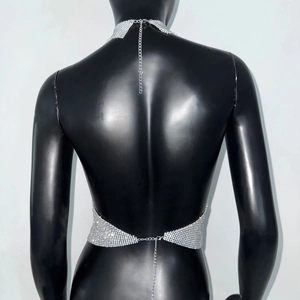 Detail of silver sequin halter top with lobster clasp and metal mesh texture