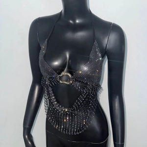 Detail of black mesh halter top with sparkling rhinestones and a metal ring connector