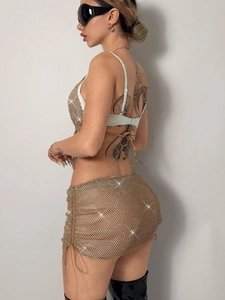 Sexy golden fishnet rhinestone two-piece set featuring a halter top and drawstring mini skirt