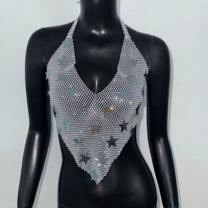 Macro shot of silver sequin mesh halter top with metallic star charms for party wear